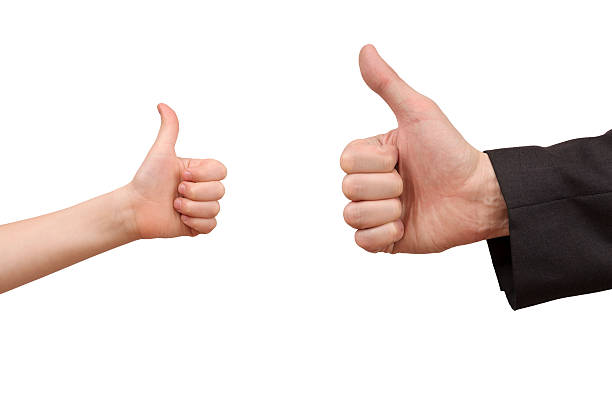 istock man and child hands showing ok sign isolated over white 472720178