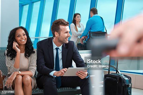 Business People Waiting For The Flight At Airport Stock Photo - Download Image Now - Businessman, Digital Tablet, Smart Phone