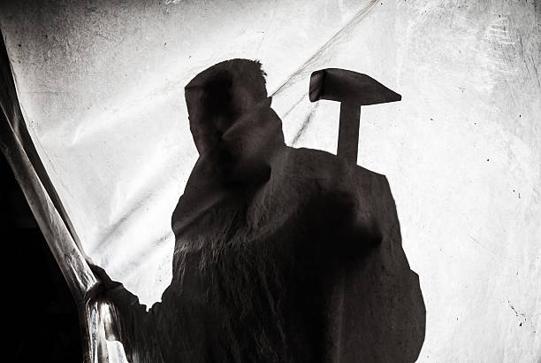 istock Silhouette of killer in action 472723186