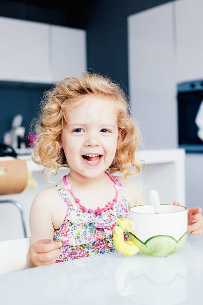 Little girl having breakfast