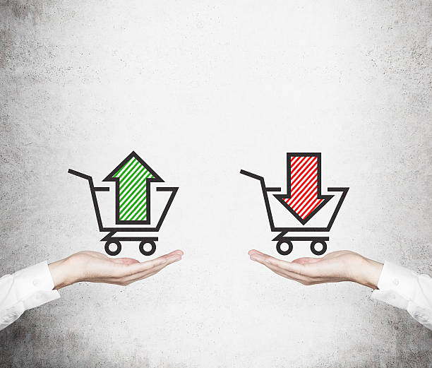 istock Hands offer the choice - 'sell or buy'. 472725478