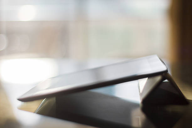 istock Digital tablet in a room at sunset 472725970
