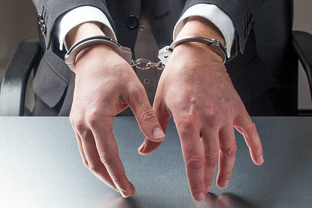 istock male manager in hostage with cuffs 472726222