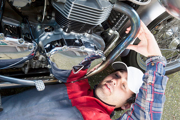 istock young mechanic repairing a vintage motorcycle 472729026
