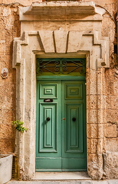istock Green House door in Malta 472731282