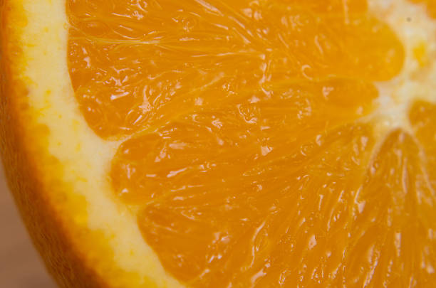 istock Extreme close up of an orange cut in half 472765012