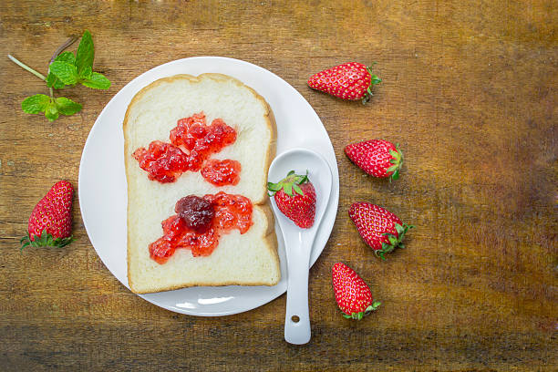 white bread and strawberry jam