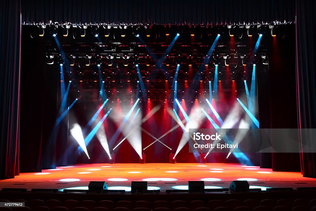 Concert stage Illuminated empty concert stage with smoke and red, white and blue beams Stage - Performance Space Stock Photo