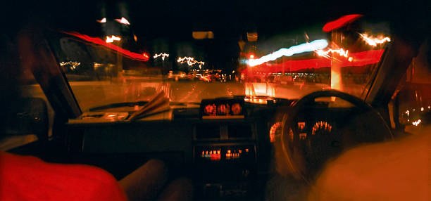 istock Fast driving on the lighted highway at night 472779614
