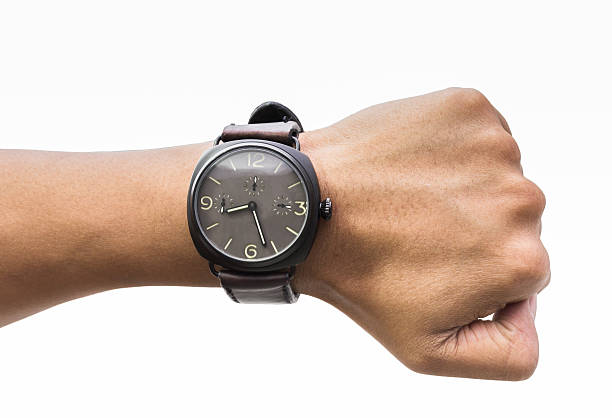 istock men wearing a black watch with leather strap on wrist 472791424