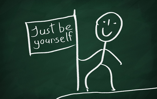 On the blackboard draw character and write Just be yourself