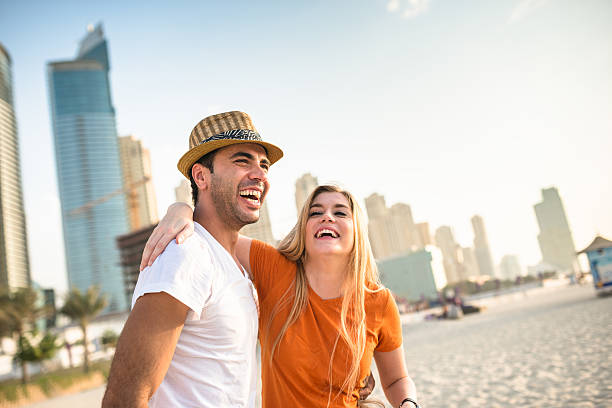 togetherness couple on the beach in Dubai marina togetherness couple on the beach dubai couple stock pictures, royalty-free photos & images
