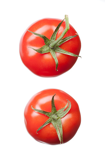 two red tomatoes isolated on white, top view