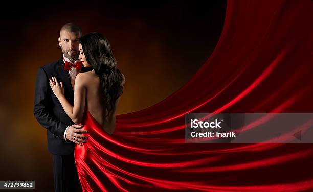 Couple Beauty Portrait Man In Suit Woman Red Rich Dress Stock Photo - Download Image Now
