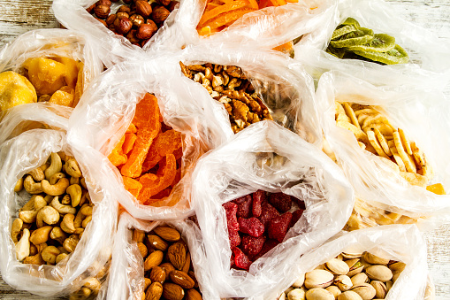 Selection of dried fruits in bags , background