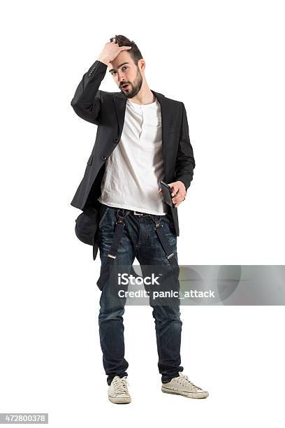Young Fashionable Man Running Fingers Through Hair Stock Photo - Download  Image Now - Hand In Hair, Men, Funky - iStock