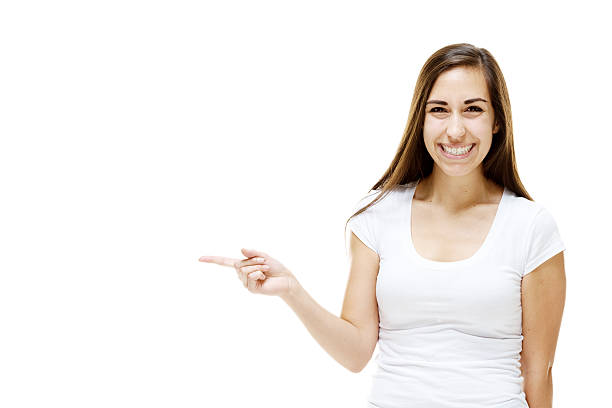 istock Cheerful woman pointing away 472800940
