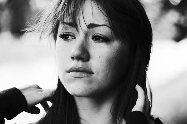 Puffy eyes. Emotional portrait of beautiful brunette. Depression, sadness, loneliness. Black and white photo