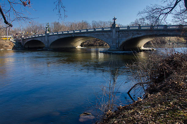 Bridge over Joseph River Shot of bridge over Joseph River in South Bend, Indiana on a gorgeous sunny day in spring.  south bend stock pictures, royalty-free photos & images