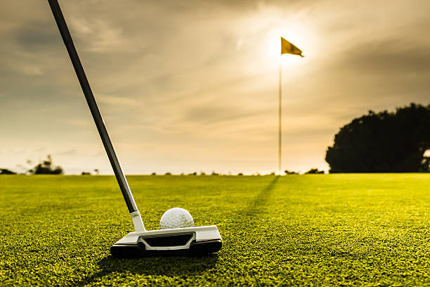 istock Golf Flag and Ball At Sunset 472809454