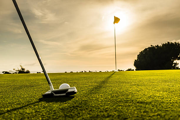 istock Golf Flag and Ball At Sunset 472809462