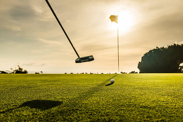 istock Golf Flag and Ball At Sunset 472809466