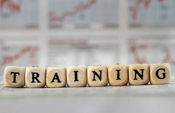 istock Training word built with letter cubes on newspaper background 472809912