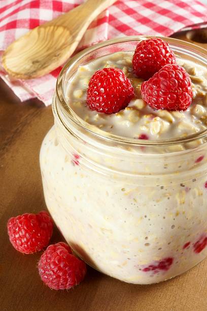 istock Overnight breakfast oats with raspberries in a mason jar 472810142