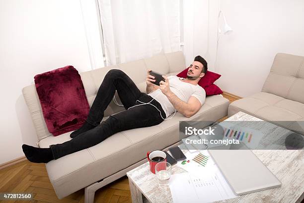 Relaxing After Work Stock Photo - Download Image Now - 2015, Adult, Adults Only