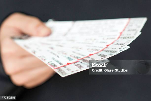 Tickets In Hand Stock Photo - Download Image Now - Ticket, Sport, Giving