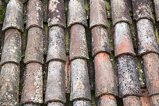 istock Unique, weathered terracotta roof background 472815624