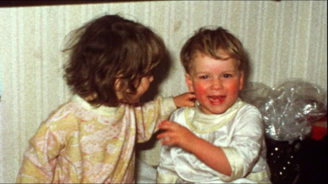 Children kissing (vintage 8 mm amateur film)