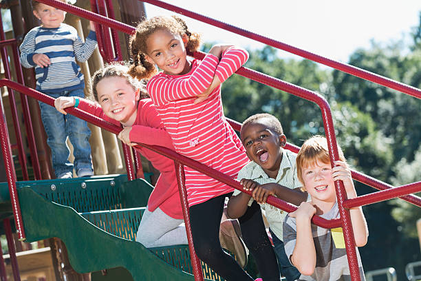istock Multi-ethnic children having fun at playground 472821752
