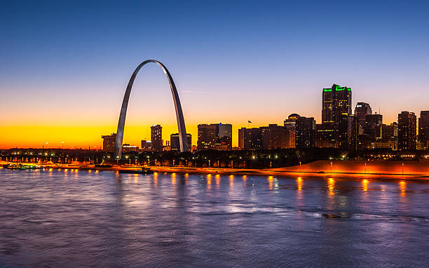 istock Saint Louis at sunset with blue/yellow sky and backlit skyline 472821758