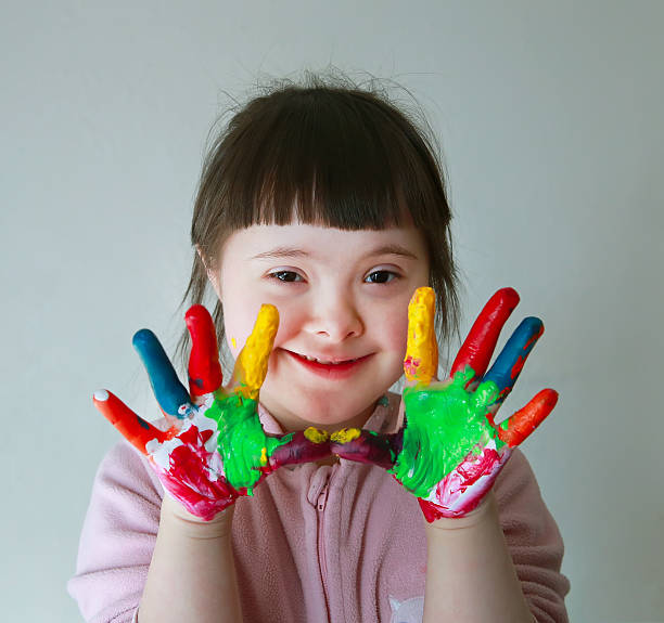 istock Cute little girl with painted hands 472821992