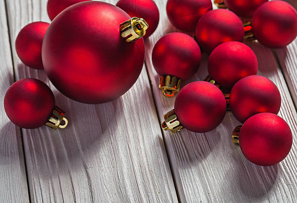 istock red christmas balls on white wooden boards 472822500