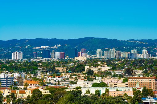 Westwood neighborhood of Los Angeles skyline view, with the Santa Monica Mountains in the background.  The Westwood skyline is one of several skylines / business districts that sits on Wilshire boulevard, which runs from Downtown Los Angeles to Santa Monica and the Pacific Ocean.