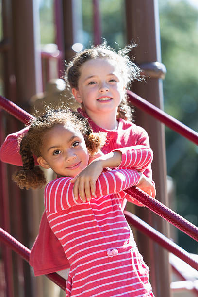 istock Two little girls playing on a playground 472823174