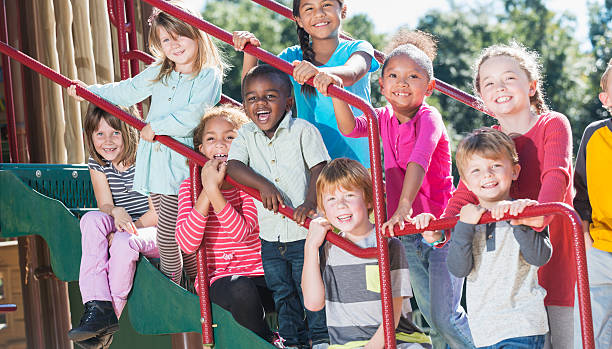 istock Group of multracial children on a playground 472823182