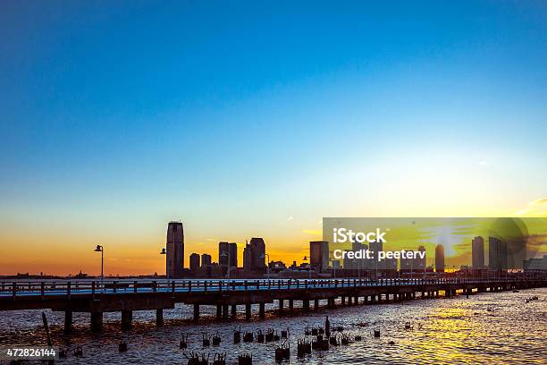 Jersey City Sunset Seen From Manhattan Stock Photo - Download Image Now - 2015, Architecture, Back Lit