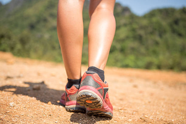 istock Woman hiking, close up on feet 472826558