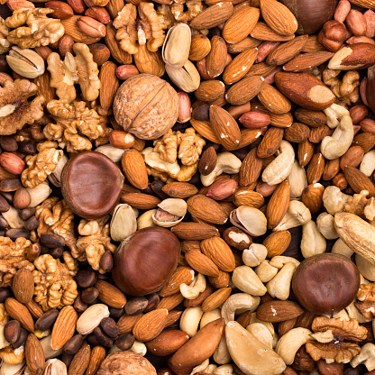 Square background of different kinds of nuts