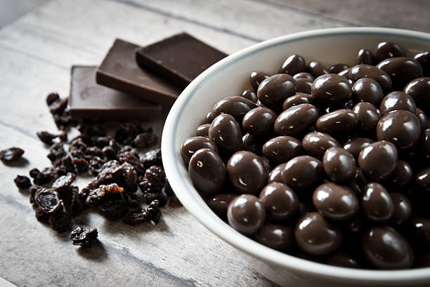 istock Bowl of chocolate coated raisins 472831282