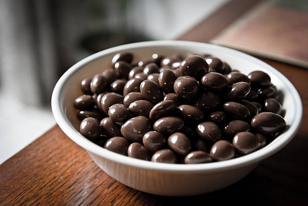 istock Bowl of chocolate coated raisins 472831284