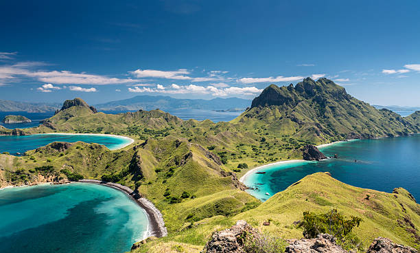 Mountain range in Komodo National Park in Indonesia Aerial view of the island 'Pulau Padar' at the famous Komodo National Park in Indonesia. Komodo is world wide famous for the beautiful underwater life, the diving sites and the Komodo dragon. Secluded white sand beaches also spot the islands of the archipelago. indonesian culture stock pictures, royalty-free photos & images