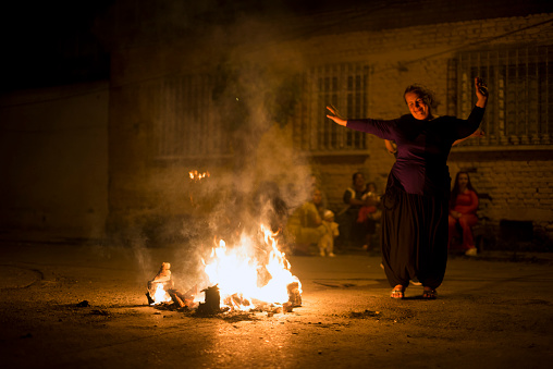 Izmir, Turkey - May 5, 2015: Izmir, Turkey - May 5, 2015: Hidirellez night. people have fun with jumping over the fire and making wishes. Hidirellez is celebrated as day on which prophets hizir and ilyas met on the earth at 5-6 May every year.