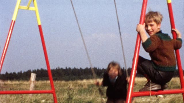 Children on swing (vintage 8mm film)
