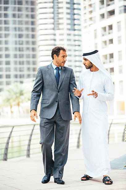 istock Emirati having outdoors business meeting 472836316