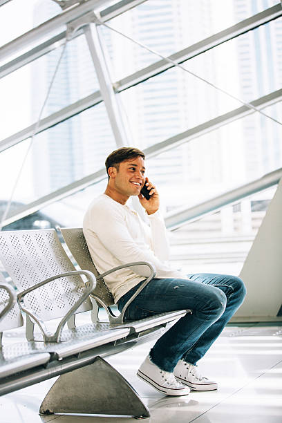 istock Young man talking on the telephone 472836330