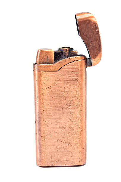 golden vintage lżejsze na białym tle - cigarette lighter gasoline open cigarette zdjęcia i obrazy z banku zdjęć